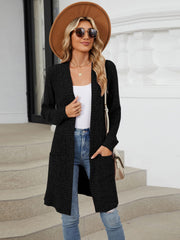 Black textured ribbed knit duster cardigan with pockets and open front.