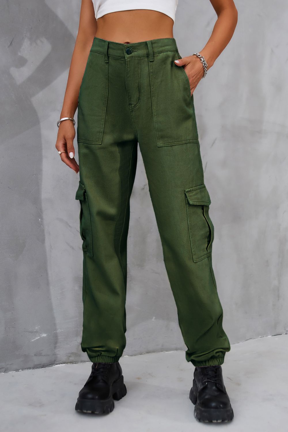 Army green utility cargo trousers with elasticated cuffs and multiple pockets.