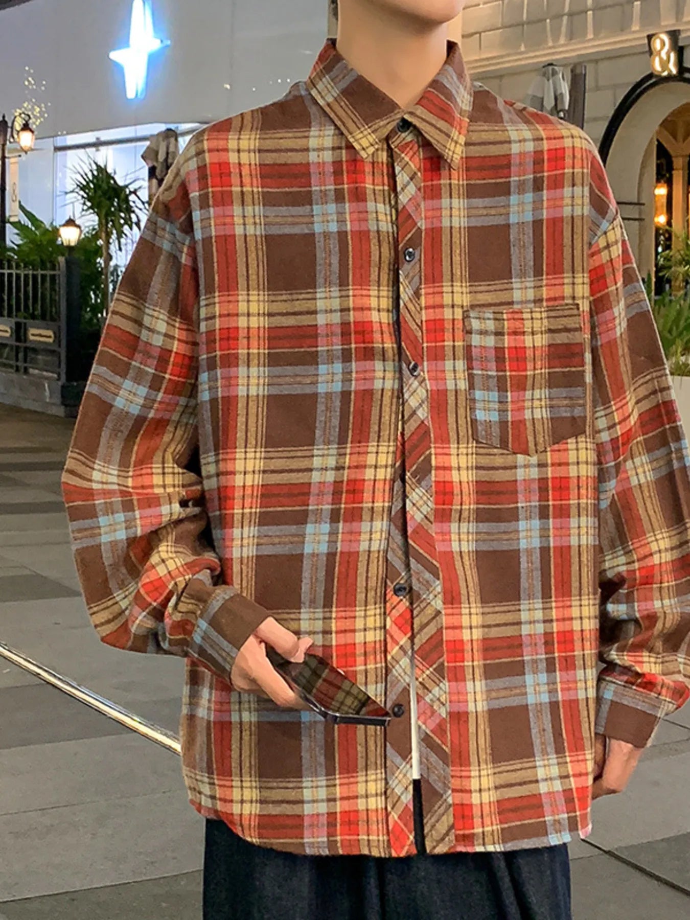 Men's casual long-sleeve plaid shirt in brown with red, yellow, and blue checks.