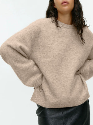 Oversized tan brushed knit crewneck sweater with ribbed cuffs and hem.