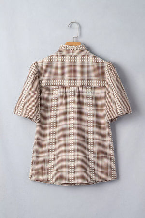 Embroidered yoke gingham puff sleeve shirt with ruffled collar and short sleeves.