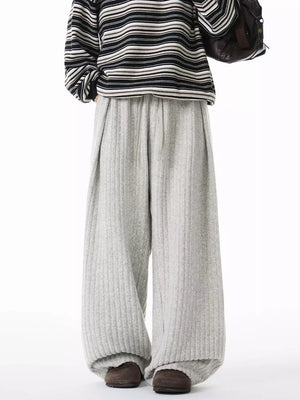 Relaxed ribbed knit sweatpants in light gray with a drawstring waist and wide leg.