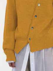 Mustard yellow knit cardigan with button front and ribbed cuffs and hem