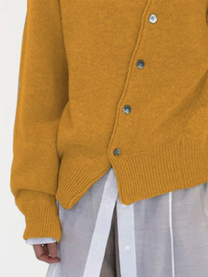 Mustard yellow knit cardigan with button front and ribbed cuffs and hem