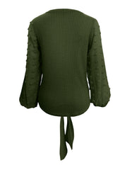 Army green waffle knit blouse with swiss dot sleeves and tie front detail.
