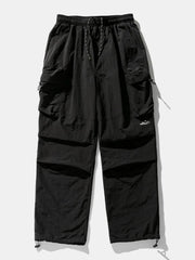 Black oversized utility cargo pants with drawstring waist and multiple cargo pockets.