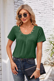 Dark green short sleeve top with gathered yoke and button trim