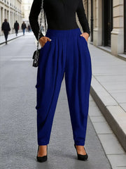 Royal blue ribbed maternity pants with pockets, cuffed ankles, and a relaxed fit.