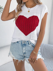 White cable knit sweater vest with a red cable knit heart graphic.