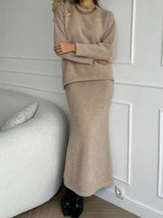 Tan textured knit co-ord set with relaxed silhouette sweater and maxi skirt.