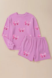 Purple sequin bow long sleeve top and shorts set with pinstripe texture.