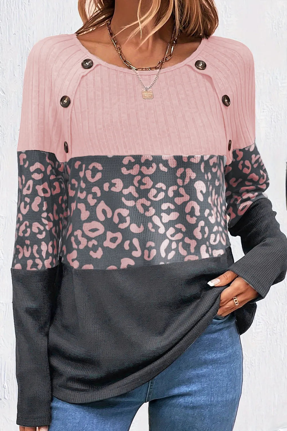 Colorblock leopard ribbed knit top in blush pink, gray, and black with button details.