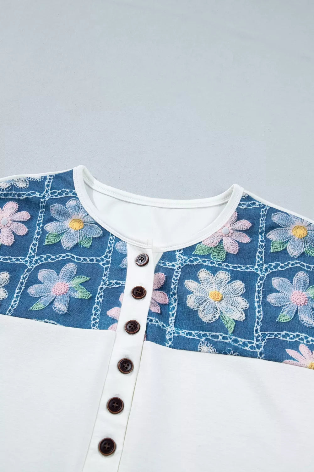 White maternity t-shirt with embroidered floral panel and button detail