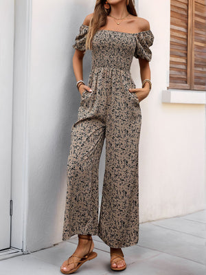 Smocked bodice floral palazzo jumpsuit in taupe with off-the-shoulder puff sleeves and wide legs.