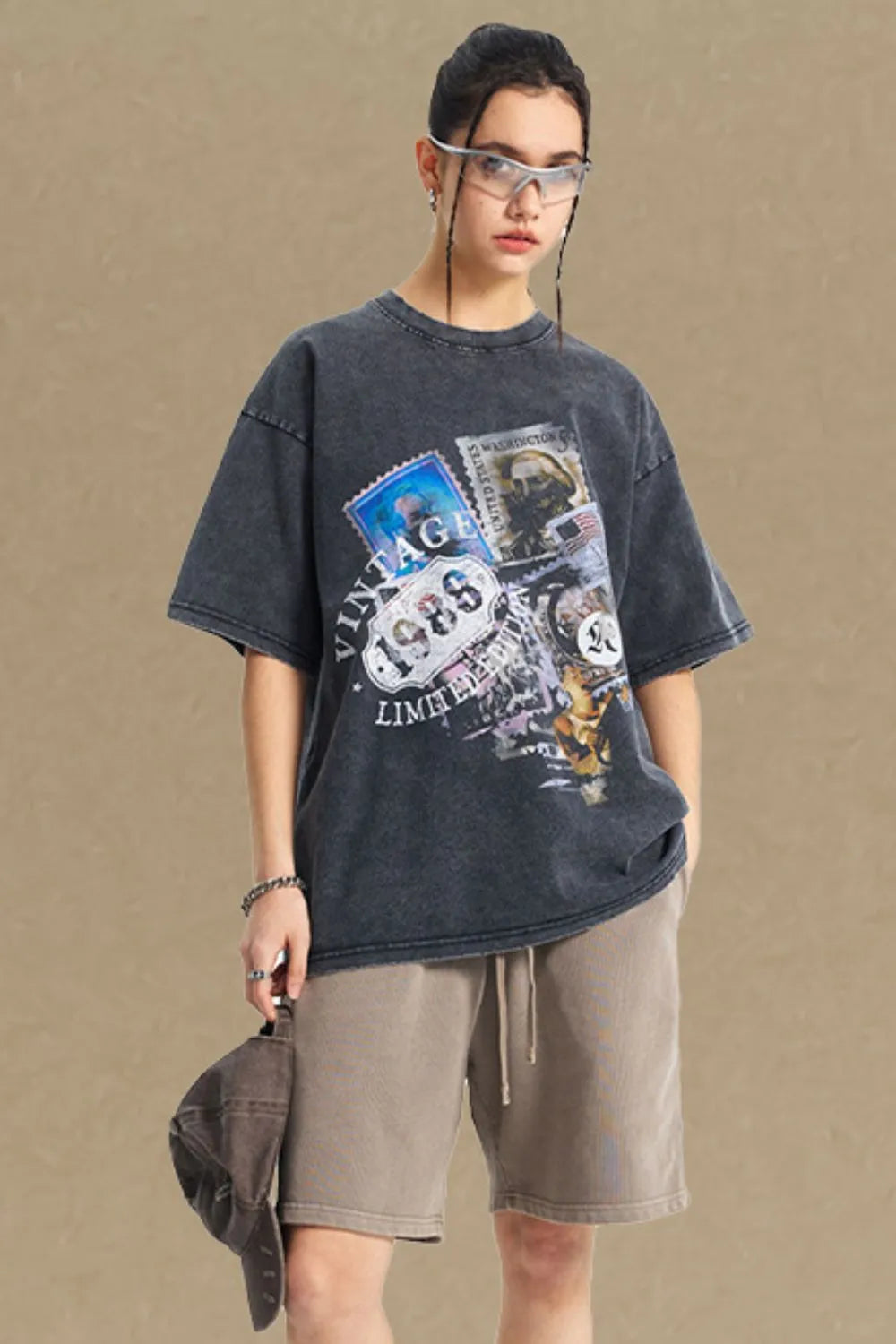 Black oversized t-shirt with vintage stamp graphic and distressed wash.
