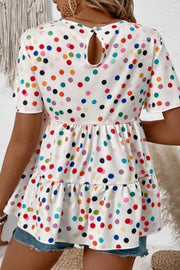 White tiered babydoll blouse with colorful polka dots and flutter sleeves.