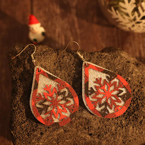 Plaid snowflake drop earrings in deep red with glitter accents.