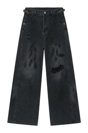 Dark wash relaxed fit denim jeans with distressed details and a buckle belt.