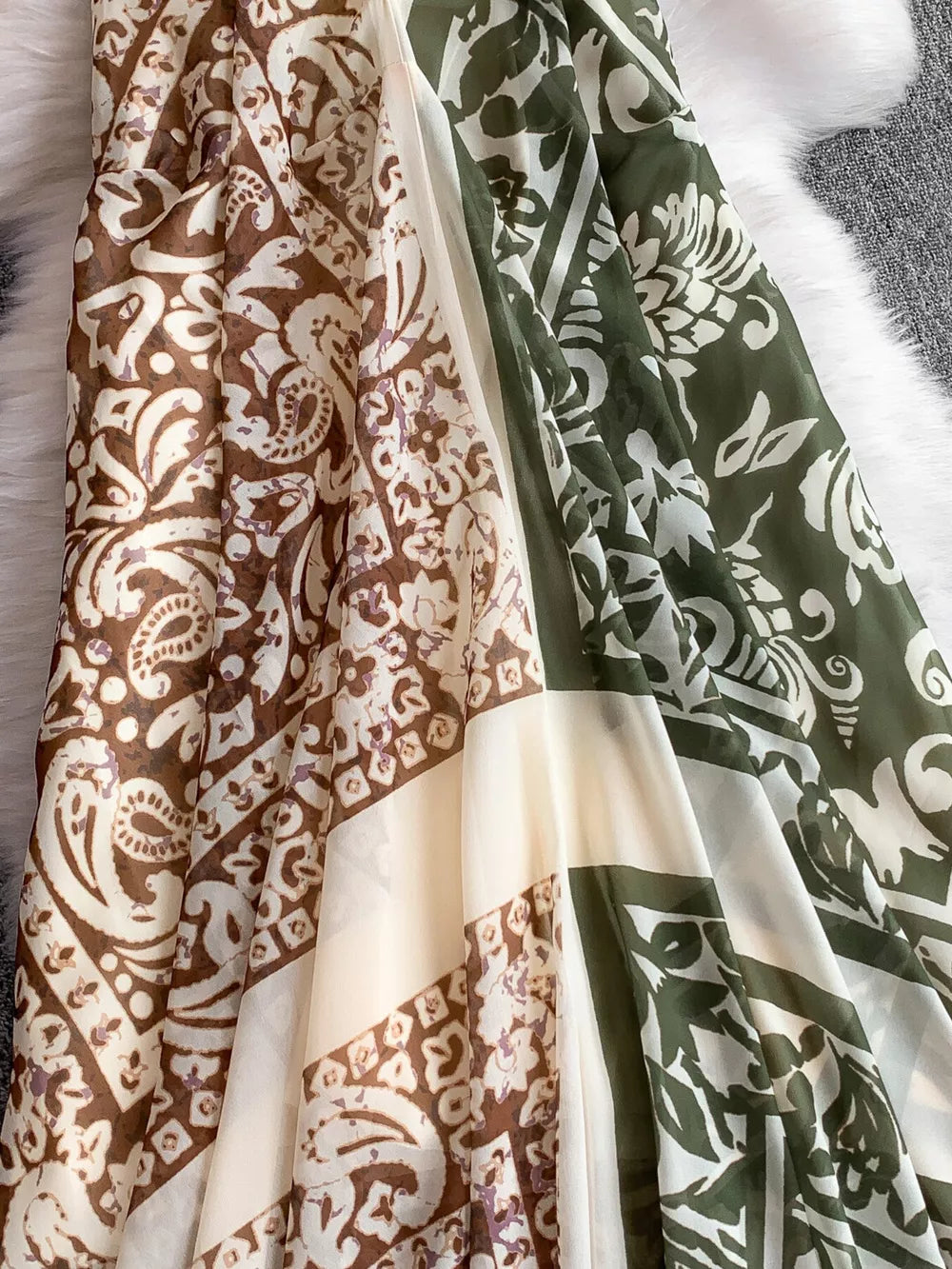 Dual-pattern V-neck cami dress with brown and green floral prints and cream panels.