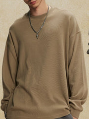 Oversized drop shoulder crewneck sweatshirt in khaki with a crew neckline and long sleeves.