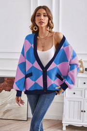 Diamond knit balloon sleeve cardigan in blue and pink with navy trim and pockets.