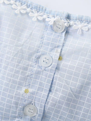 Baby dress with blue gingham, white lace trim, and daisy embroidery.