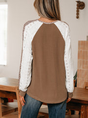 Waffle knit henley top in taupe with white lace sleeves and animal print accents.