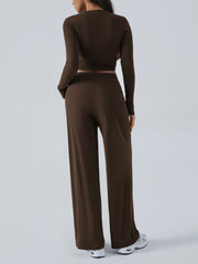 Coffee brown ribbed knit crop top and wide leg pants set from the back.
