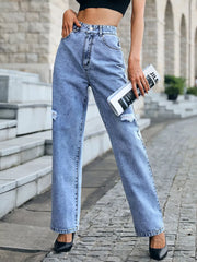 Ripped high-waisted light wash denim jeans with a button closure and straight leg cut.