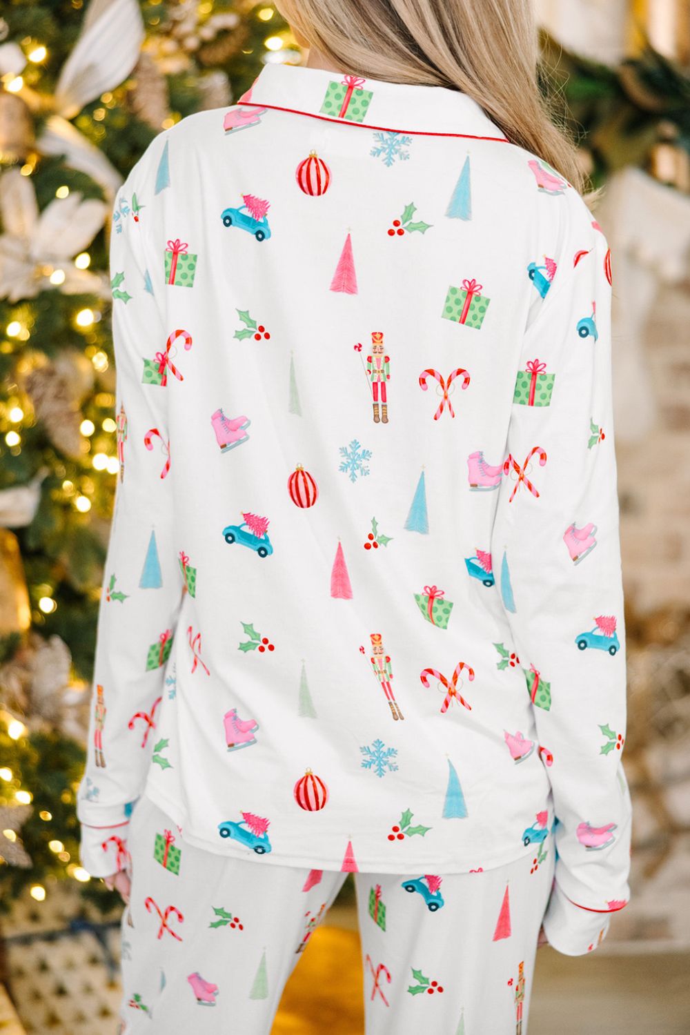 White festive print pajama set with contrast trim and Christmas motifs.