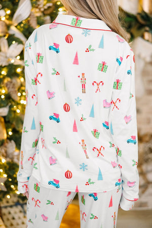 White festive print pajama set with contrast trim and Christmas motifs.
