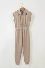 Collared zip front romper in tan with cap sleeves and ankle cuffs