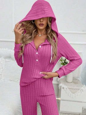 Ribbed knit lounge set in hot pink with buttoned henley neckline and hood.