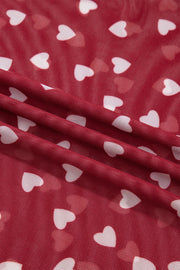 Deep red sheer t-shirt with white heart print, mesh fabric detail.
