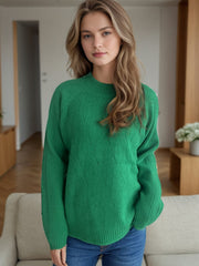 Dark green textured knit raglan sleeve pullover sweater with mock neck and diamond pattern.