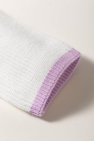 Colorblock ribbed quarter-zip pullover in white with a lavender trim detail on the sleeve cuff.