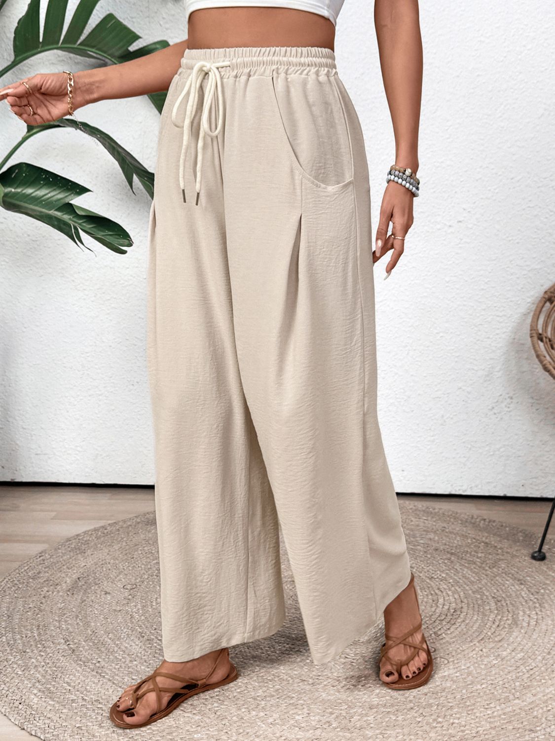 Tan Luxe Drape Palazzo Trousers with drawstring waist and wide legs.