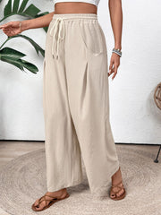 Tan Luxe Drape Palazzo Trousers with drawstring waist and wide legs.