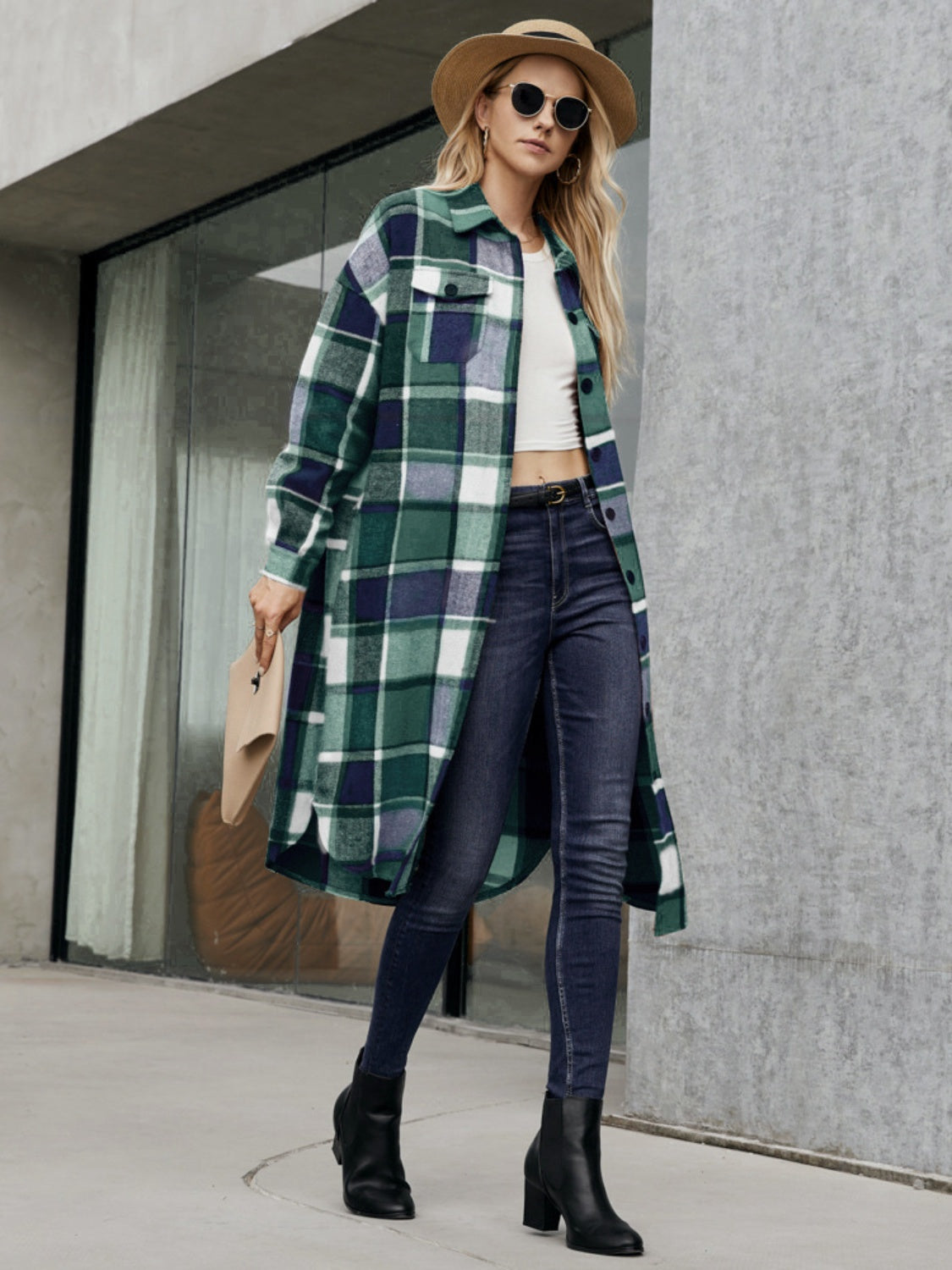 Oversized plaid shirt jacket dress in green and navy with button front and pockets.