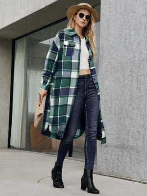 Oversized plaid shirt jacket dress in green and navy with button front and pockets.