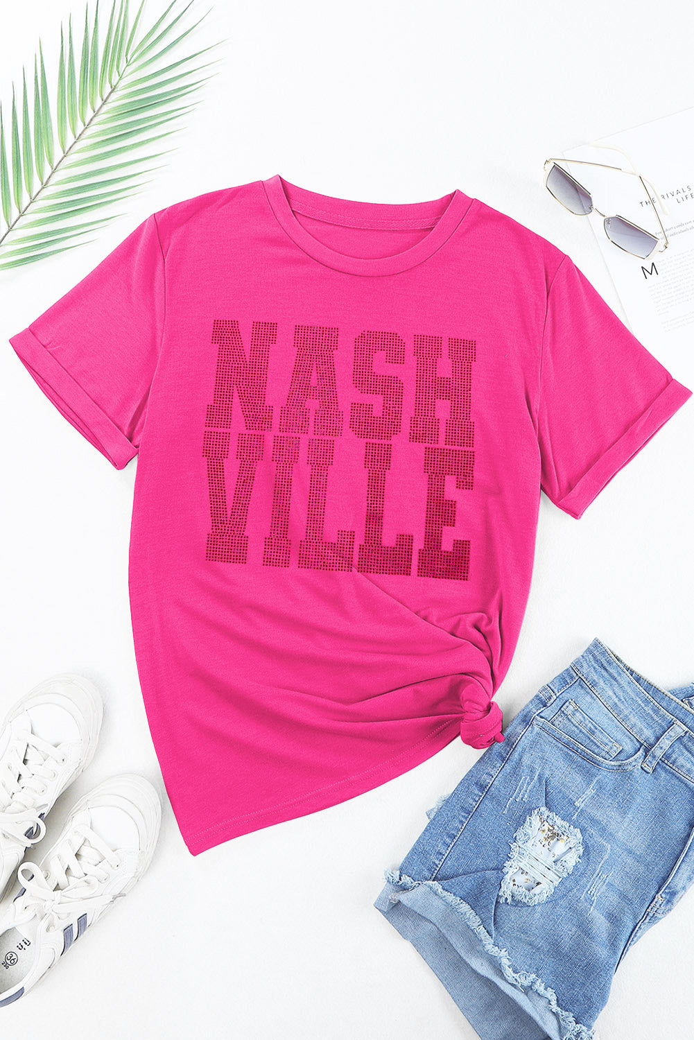 Hot pink t-shirt with rolled sleeves and Nashville graphic, tied at the waist