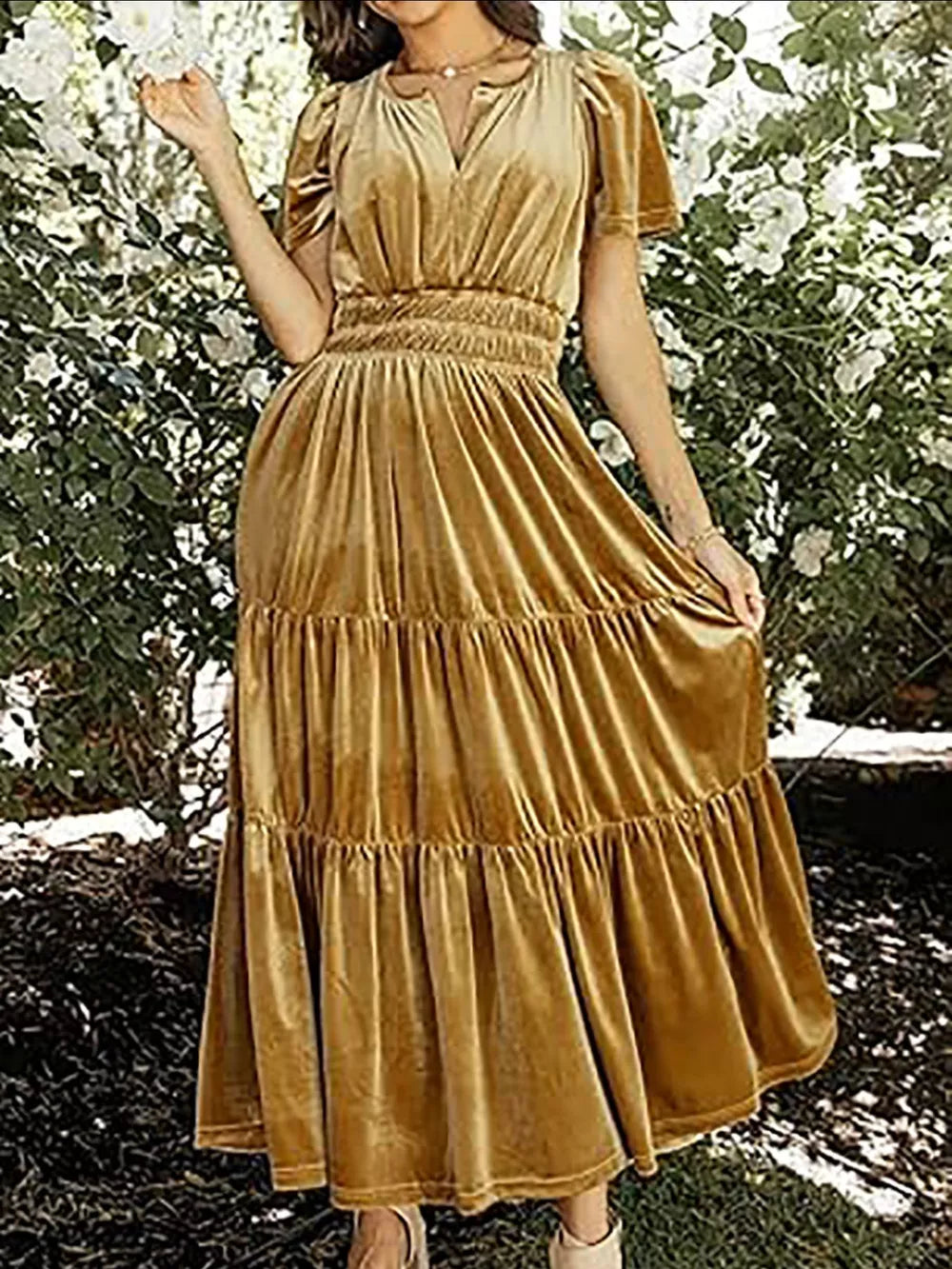 Ruched velvet maxi dress with pockets in gold, featuring short sleeves and a tiered skirt.
