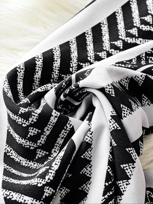 Black and white geometric print wide-leg maternity pants with bow detail