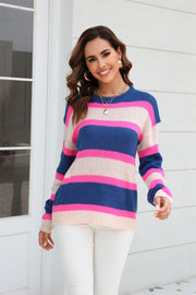 Crewneck knit sweater with bold blue, pink, and beige stripes.
