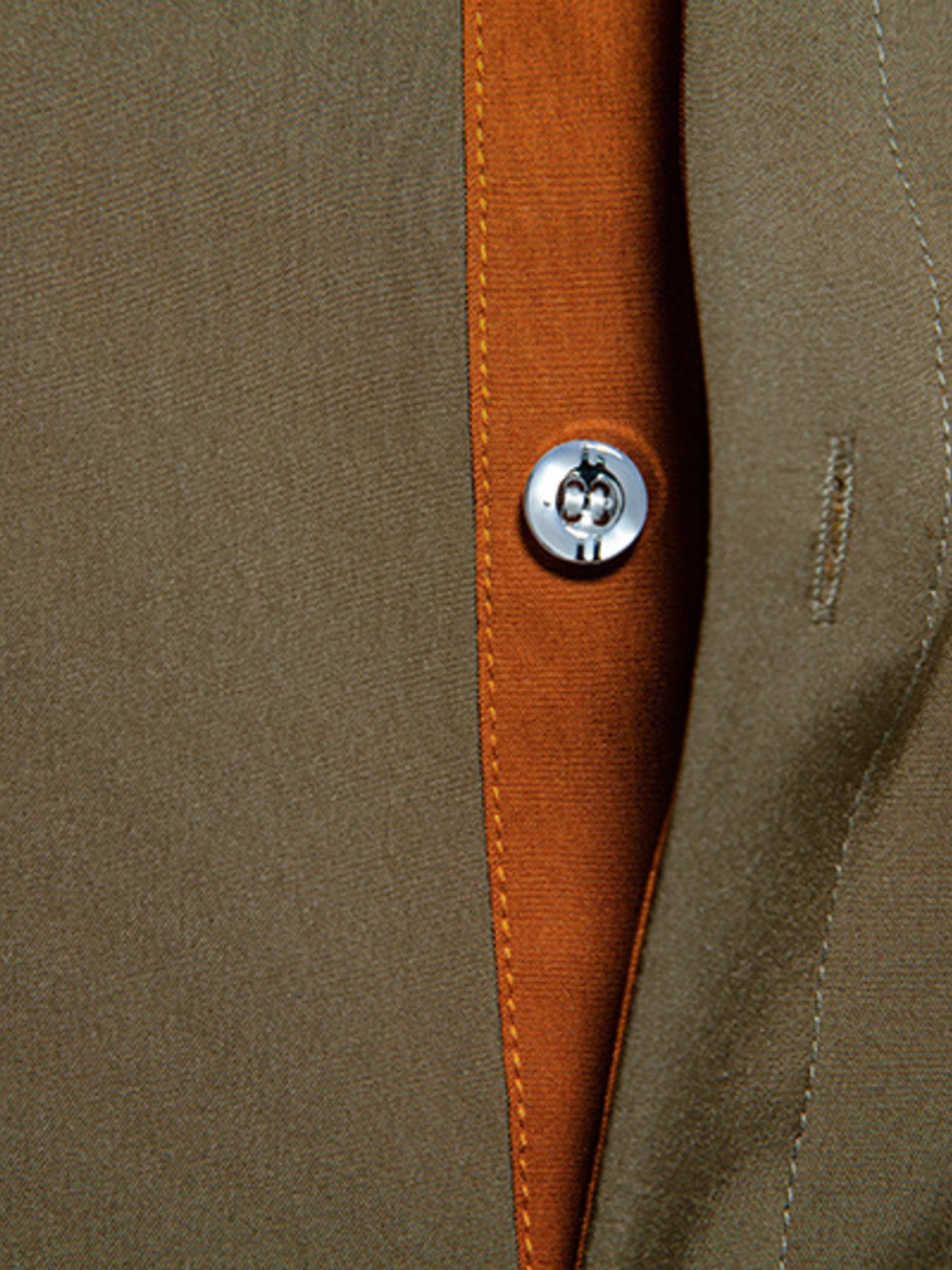 Olive green button-down shirt with contrast trim and button detail