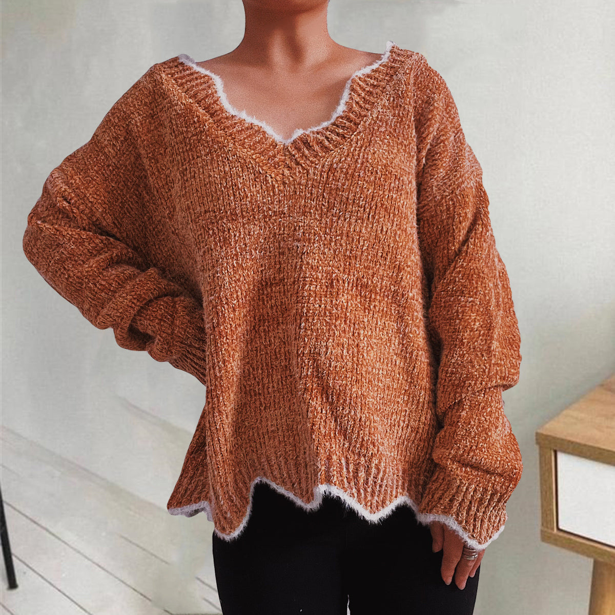 Caramel v-neck knit sweater with scalloped trim and fuzzy texture.