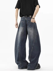 Distressed wide-leg jeans in Vintage Blue denim with a belt, shown from the back.