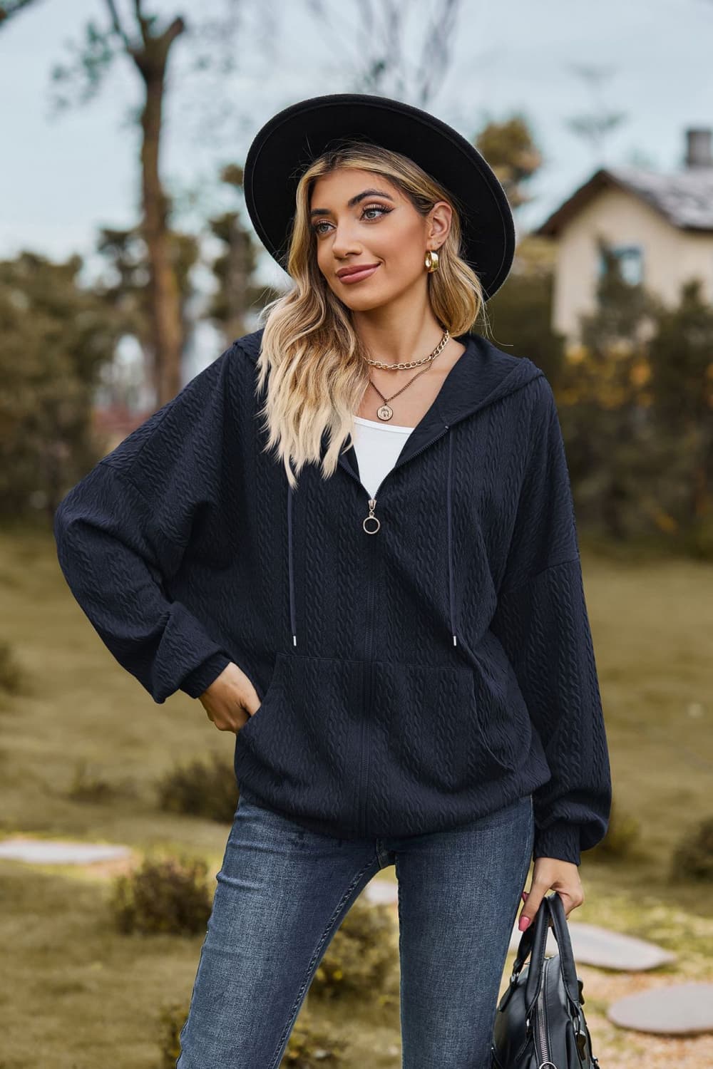 Dark Blue textured cable knit zip-up hoodie with a kangaroo pocket and drawstring hood.