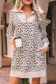 Leopard print zip-up collar mini dress with pockets and long sleeves.