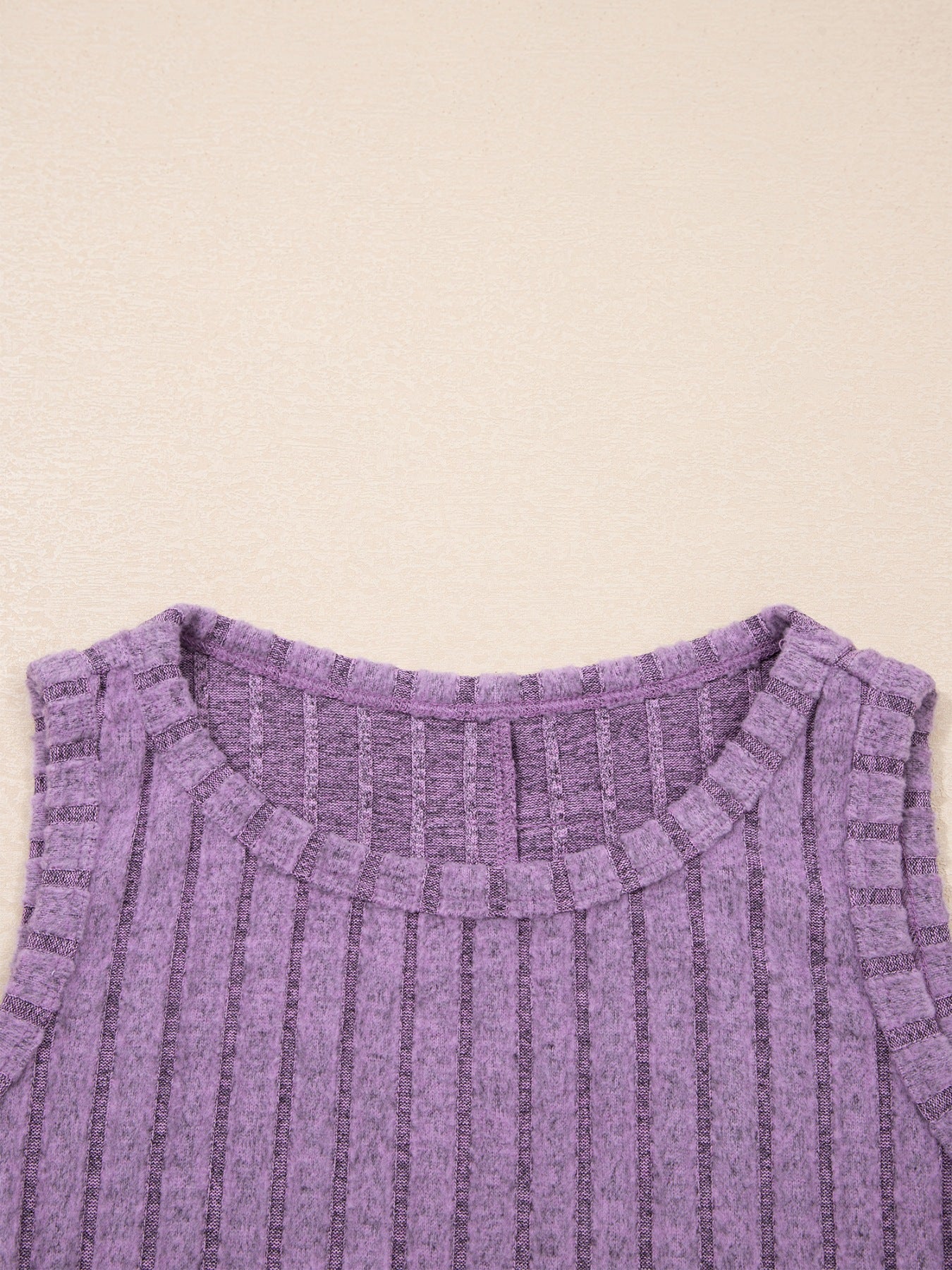Slim ribbed tank top in purple with a crew neck and sleeveless cut.